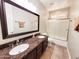 Bathroom featuring a double sink vanity with a granite countertop and a glass-enclosed shower at 1681 S Karen Dr, Chandler, AZ 85286