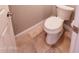 Neat toilet with a tiled floor at 1681 S Karen Dr, Chandler, AZ 85286