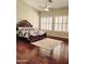 Spacious bedroom featuring vaulted ceilings, a ceiling fan, and wood floors at 1681 S Karen Dr, Chandler, AZ 85286