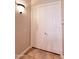 A closet with paneled doors and tile flooring at 1681 S Karen Dr, Chandler, AZ 85286