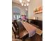 Dining room with a wooden table, soft natural light, decorative accents and elegant design at 1681 S Karen Dr, Chandler, AZ 85286