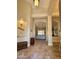 Open concept home foyer with decor alcove and view to the living room with neutral colored walls at 1681 S Karen Dr, Chandler, AZ 85286