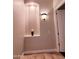 Stylish hallway with decorative niche and a neutral color scheme at 1681 S Karen Dr, Chandler, AZ 85286