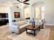 Spacious living room with tile flooring, decorative archways and view into the kitchen at 1681 S Karen Dr, Chandler, AZ 85286