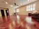 Open living room features wood floors, shutters, and recessed lighting at 1681 S Karen Dr, Chandler, AZ 85286