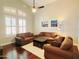 Comfortable living room with a ceiling fan, white rug and modern decor at 1681 S Karen Dr, Chandler, AZ 85286