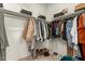 Walk-in closet featuring ample hanging space, shelving and shoe storage at 17344 W Red Fox Rd, Surprise, AZ 85387