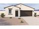 Inviting single-story home featuring a 2-car garage and desert landscaping at 18219 W La Senda Dr, Surprise, AZ 85387