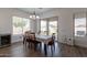 Bright dining area featuring wood floors and a sliding glass door leading to the backyard at 19042 E Arrowhead Trl, Queen Creek, AZ 85142