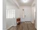 Bright foyer with wood floors, white walls, and staircase at 19042 E Arrowhead Trl, Queen Creek, AZ 85142