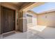 Covered front porch featuring a stylish front door and neutral color palette at 19042 E Arrowhead Trl, Queen Creek, AZ 85142