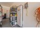 Organized garage space featuring shelving units and Generac battery for energy storage at 19042 E Arrowhead Trl, Queen Creek, AZ 85142