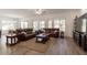 Spacious living room with wood floors, comfortable sofas, and natural light at 19042 E Arrowhead Trl, Queen Creek, AZ 85142