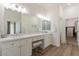 Large main bathroom featuring double sinks, white cabinets, and a vanity area at 19042 E Arrowhead Trl, Queen Creek, AZ 85142