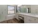 Bright main bathroom featuring a double vanity, a soaking tub, and a separate shower at 19042 E Arrowhead Trl, Queen Creek, AZ 85142