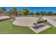 Community splash pad and playground area with benches and seating, ideal for Gathering fun at 19042 E Arrowhead Trl, Queen Creek, AZ 85142