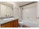 Bathroom featuring a sink, toilet, and bathtub with tiled shower at 1976 N Lemon Tree Ln # 16, Chandler, AZ 85224