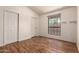 Bedroom with hard wood flooring and two closets at 1976 N Lemon Tree Ln # 16, Chandler, AZ 85224