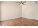 Bedroom featuring wood flooring, a ceiling fan, and neutral walls at 1976 N Lemon Tree Ln # 16, Chandler, AZ 85224
