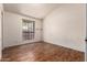 Comfortable bedroom with hard wood flooring and a nice, bright window at 1976 N Lemon Tree Ln # 16, Chandler, AZ 85224
