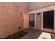 Exterior view of the unit with a walkway to the front door at 1976 N Lemon Tree Ln # 16, Chandler, AZ 85224