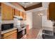 Kitchen with stainless steel appliances and granite countertops extending into eat-in dining area at 1976 N Lemon Tree Ln # 16, Chandler, AZ 85224