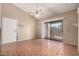 Living area featuring neutral colors, tile flooring, and sliding door access to backyard at 1976 N Lemon Tree Ln # 16, Chandler, AZ 85224