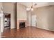 Living room featuring a fireplace, neutral colors, tile flooring, and access to the kitchen at 1976 N Lemon Tree Ln # 16, Chandler, AZ 85224