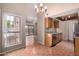 Open floor plan with kitchen extending to living area and outdoor access at 1976 N Lemon Tree Ln # 16, Chandler, AZ 85224