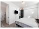 Bedroom with closet and TV, along with tile floors at 201 S Greenfield Rd # 215, Mesa, AZ 85206