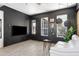 Comfortable living area featuring a black brick wall and bright sunlight at 201 S Greenfield Rd # 215, Mesa, AZ 85206