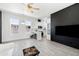 Bright living room featuring an accent brick wall, and modern finishes at 201 S Greenfield Rd # 215, Mesa, AZ 85206