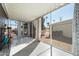 Relaxing screened-in patio with views of palm trees and a light-colored building at 201 S Greenfield Rd # 215, Mesa, AZ 85206