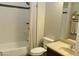 Bathroom features a white tiled shower-tub combination and a vanity with a tan countertop at 20243 E Poco Calle --, Queen Creek, AZ 85142