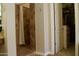 Bathroom shower and walk-in closet with storage in a modern-style home at 20243 E Poco Calle --, Queen Creek, AZ 85142