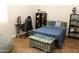 Comfortable bedroom with modern decor, a gaming chair, desk, and ample storage at 20243 E Poco Calle --, Queen Creek, AZ 85142