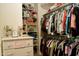 Organized walk-in closet with dresser, shelves, and clothing racks for ample storage at 20243 E Poco Calle --, Queen Creek, AZ 85142
