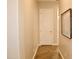 Hallway with tile floors leads to rooms; map decorates a wall at 20243 E Poco Calle --, Queen Creek, AZ 85142