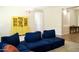 Comfortable living room showcases a blue sectional sofa and bright yellow hutch at 20243 E Poco Calle --, Queen Creek, AZ 85142