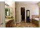 Ensuite bathroom boasts double vanities, walk-in closet, and soaking tub with tiled floor at 20243 E Poco Calle --, Queen Creek, AZ 85142