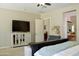 Comfortable main bedroom features closet and ensuite bathroom, with neutral colors and carpeted floor at 20243 E Poco Calle --, Queen Creek, AZ 85142