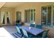 Covered patio with an outdoor dining set and outdoor kitchen at 20243 E Poco Calle --, Queen Creek, AZ 85142