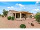 Beautiful backyard with covered patio, perfect for outdoor living and enjoying the landscaped surroundings at 20450 N Shadow Mountain Dr, Surprise, AZ 85374