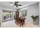 Cozy dining area with access to the outdoor patio, featuring tile floors and a classic grandfather clock at 20450 N Shadow Mountain Dr, Surprise, AZ 85374