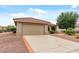 Inviting single-story home featuring a two-car garage and desert landscaping for low maintenance appeal at 20450 N Shadow Mountain Dr, Surprise, AZ 85374
