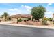 Charming single-story home with desert landscaping, a two-car garage, and well-maintained front yard at 20450 N Shadow Mountain Dr, Surprise, AZ 85374