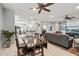 Spacious living area features tile floors, ceiling fans, and an open layout into the kitchen and dining room at 20450 N Shadow Mountain Dr, Surprise, AZ 85374