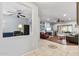 Open-concept design, showcasing the office and living room with neutral tones and modern ceiling fans at 20450 N Shadow Mountain Dr, Surprise, AZ 85374