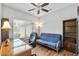 Cozy home office featuring a desk, futon, ceiling fan and natural light at 20450 N Shadow Mountain Dr, Surprise, AZ 85374