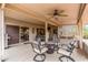 Inviting covered patio with seating area, ceiling fan and desert landscape views at 20450 N Shadow Mountain Dr, Surprise, AZ 85374